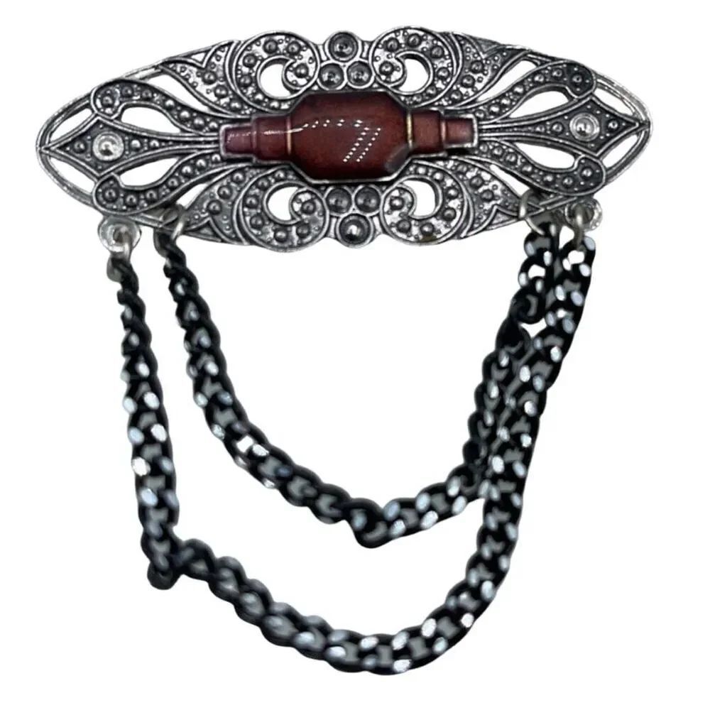 Vintage Victorian looking enamel dropping chains brooch.